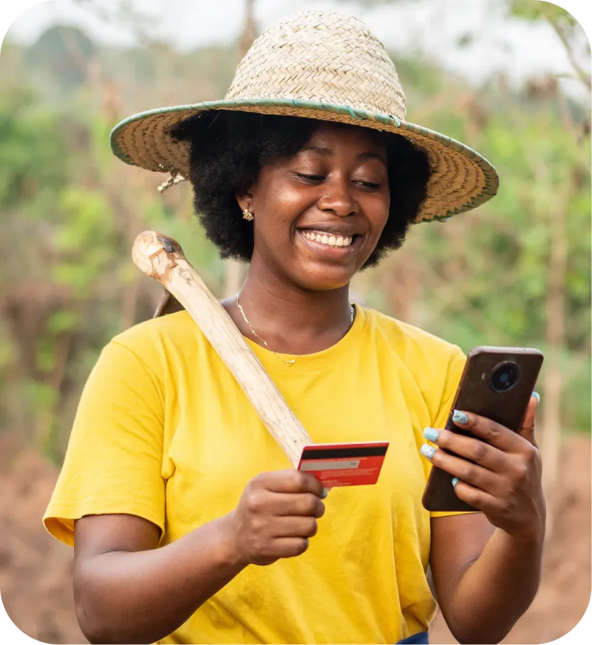 African woman holding bank card and smartphone for digital banking